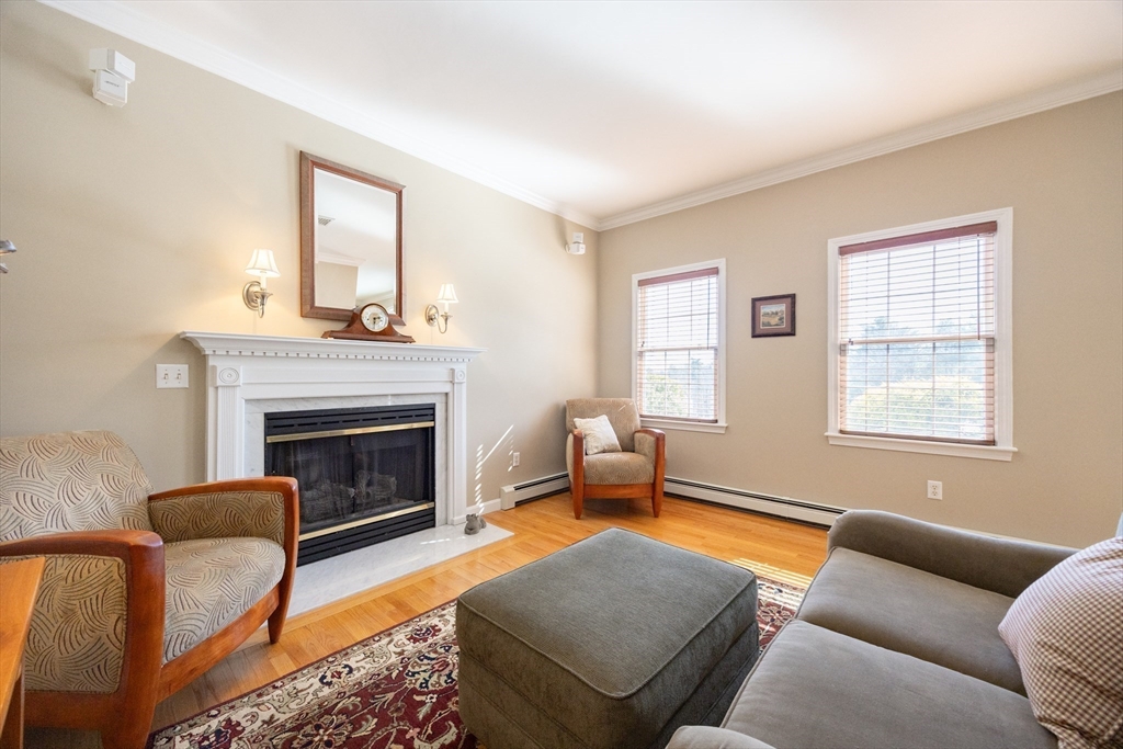 48 Laurel Drive Hudson, MA 01749 - Photo 7 of 42 a living room with furniture a window and a fireplace