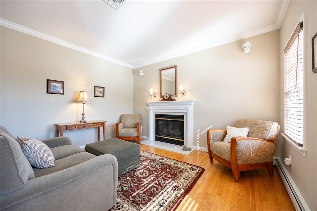 48 Laurel Drive Hudson, MA 01749 - Photo 8 of 42 a living room with furniture and a fireplace