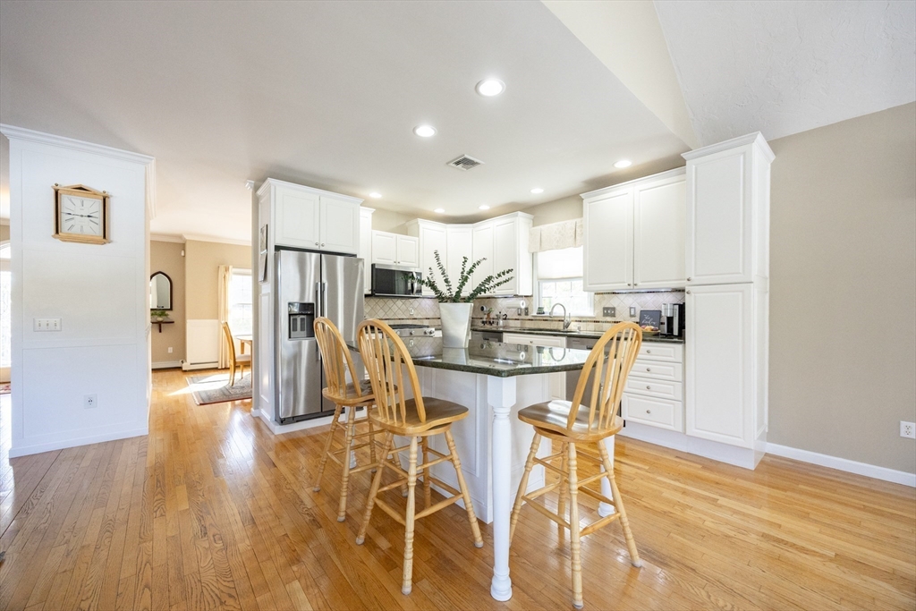 48 Laurel Drive Hudson, MA 01749 - Photo 9 of 42 a view of a dining room with furniture and wooden floor