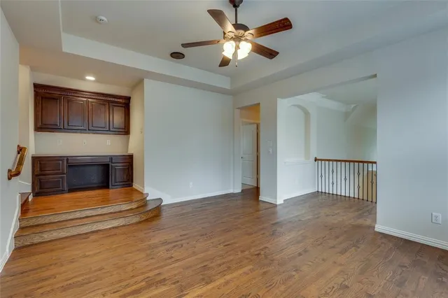 a view of livingroom and kitchen with wooden floor