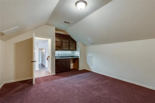 a view of empty room with a fireplace