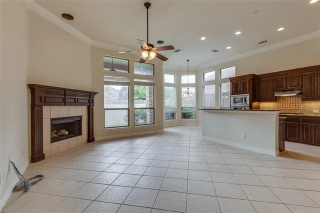 a view of a kitchen with microwave and stove top oven