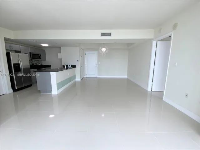a view of a kitchen with a sink