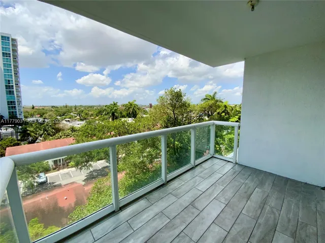 a balcony with wooden floor