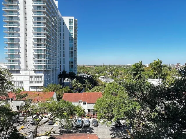 a black and white photo of a bench