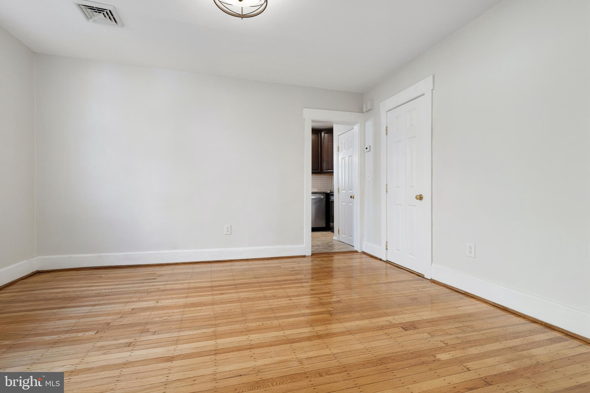 229 Wayne Avenue Narberth, PA 19072 - Photo 11 of 35 a view of an empty room with wooden floor