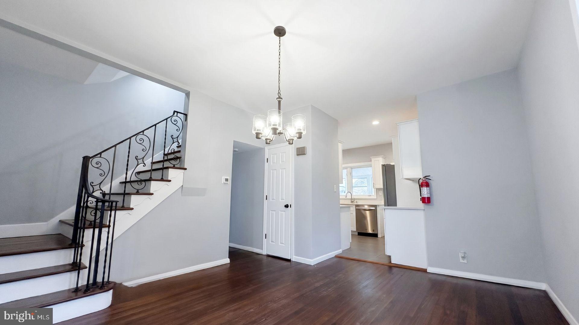 154 Andrew Street Hamilton, NJ 08610 - Photo 6 of 29 a view of a room with wooden floor and staircase