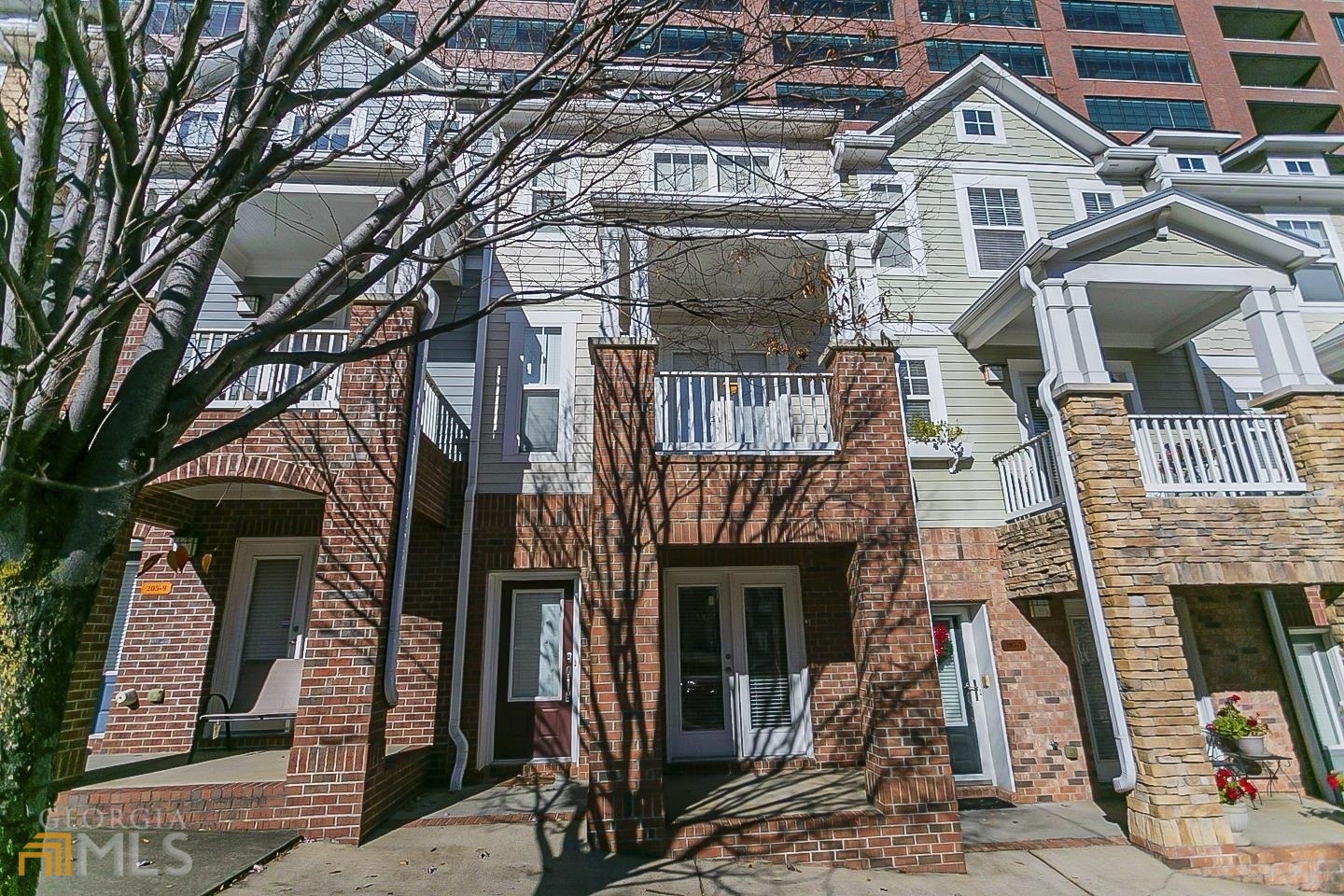 205 16th Street Northwest, Unit 8 Atlanta, GA 30363 - Photo 1 of 1 a front view of a house with iron stairs