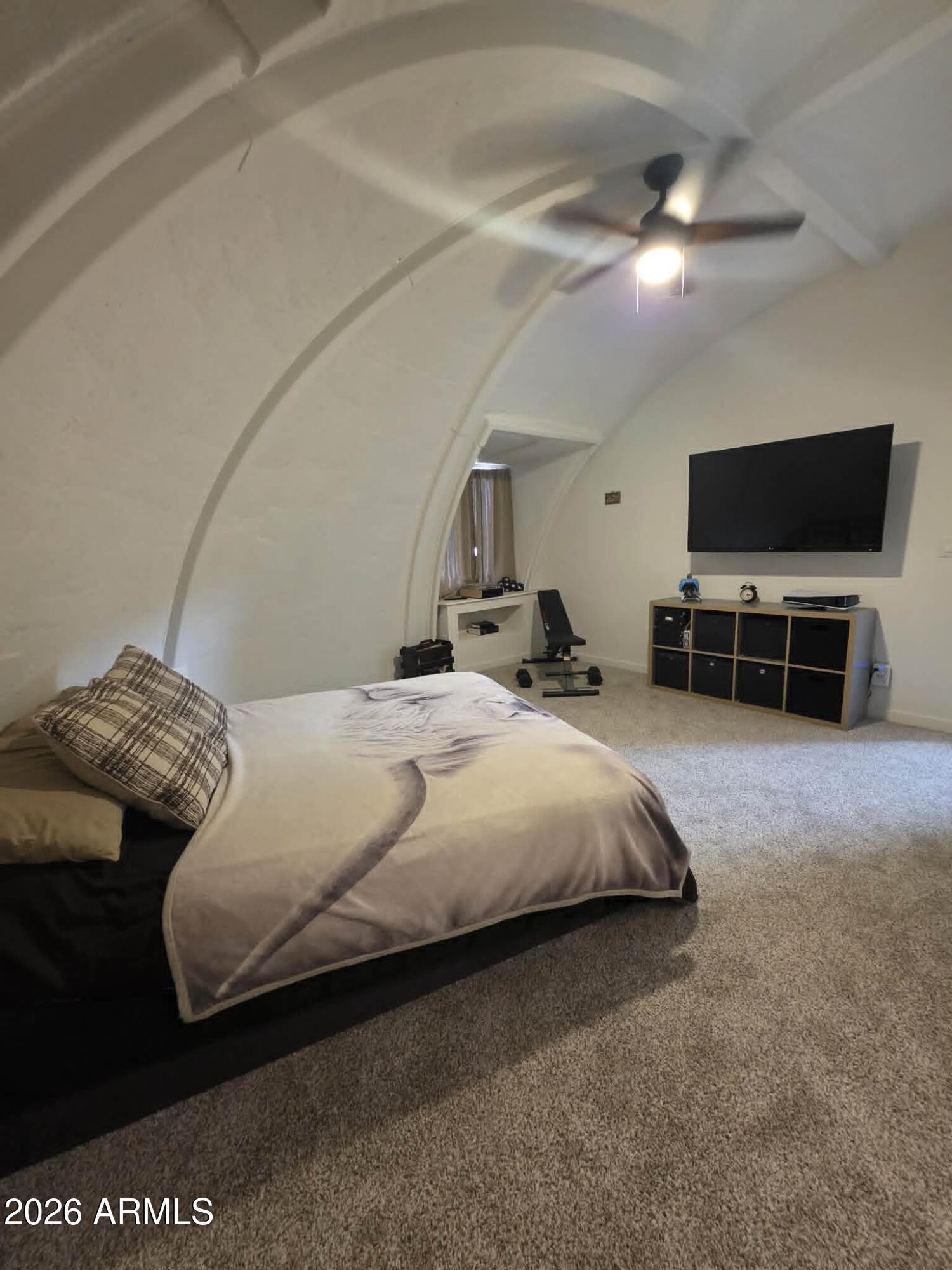 1523 South Warren Road Maricopa, AZ 85139 - Photo 15 of 26 a bedroom with a bed and a television in it