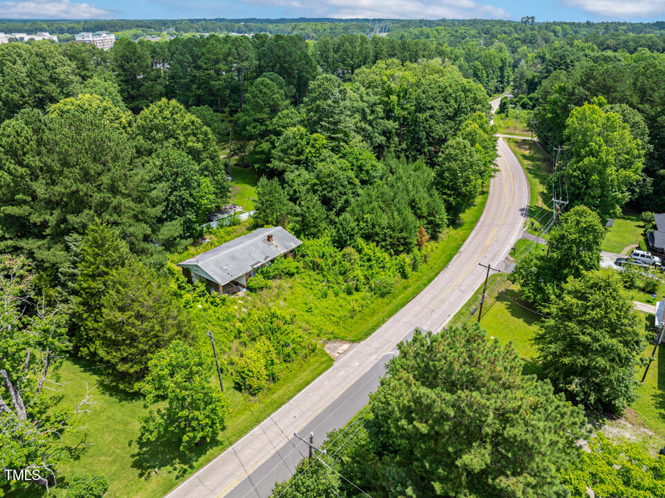 7516 Massey Chapel Road Durham, NC 27713 - Photo 4 of 12 a view of a garden with a building