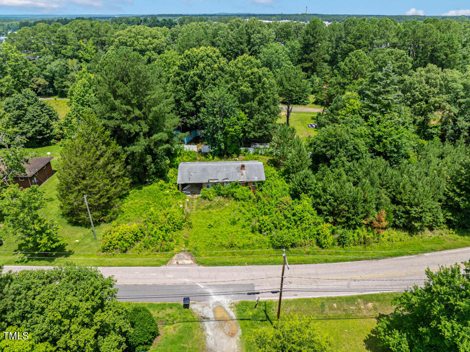 7516 Massey Chapel Road Durham, NC 27713 - Photo 5 of 12 a view of a garden with a bench