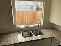 an empty room with wooden floor and closet