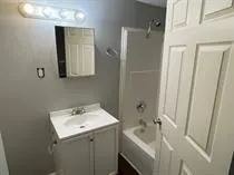 a bathroom with a sink and mirror