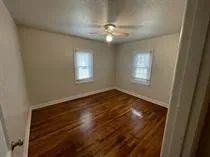a bathroom with a sink and mirror with toilet