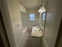 a bathroom with a sink and mirror