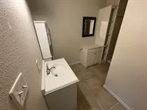 a bathroom with a toilet and a sink