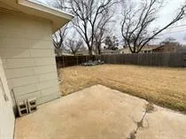 a bathroom with a granite countertop sink a mirror and a shower