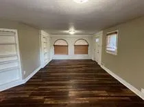 a kitchen with a sink stove and refrigerator