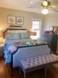 a view of a room with wooden floor and fireplace