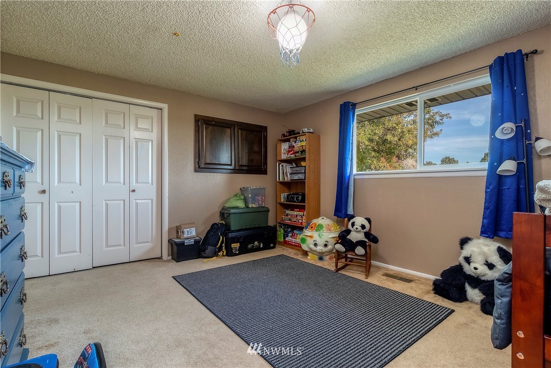 356 Bussell Road Walla Walla, WA 99362 - Photo 20 of 34 a living room filled with furniture stairs and a window