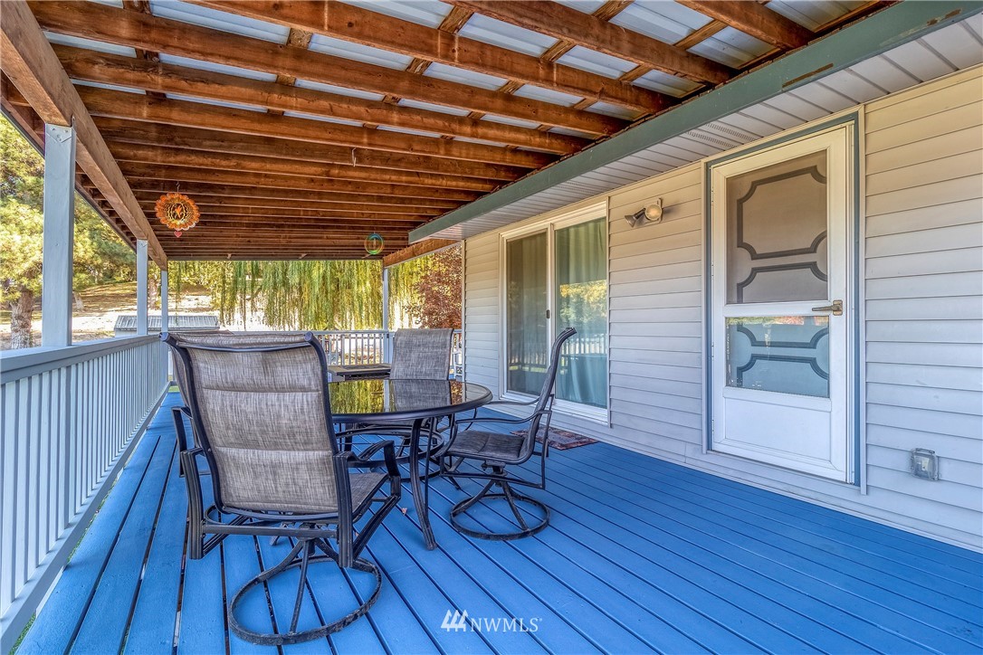 356 Bussell Road Walla Walla, WA 99362 - Photo 33 of 34 a view of a deck with wooden floor and outdoor seating