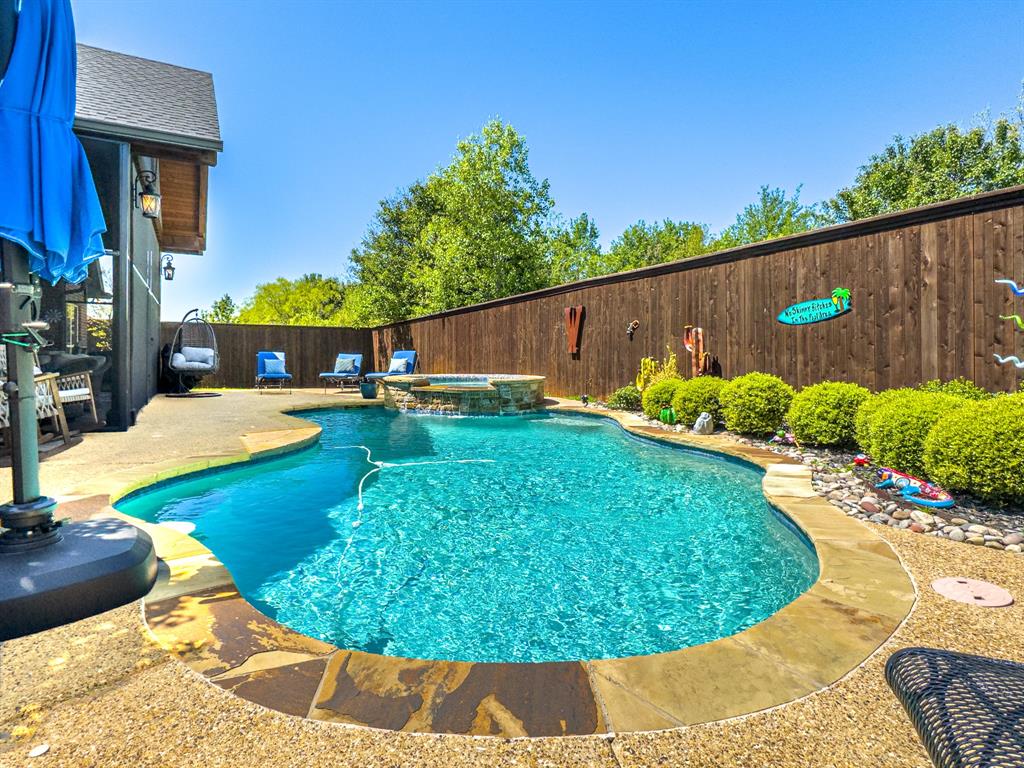 a view of a swimming pool with an outdoor space