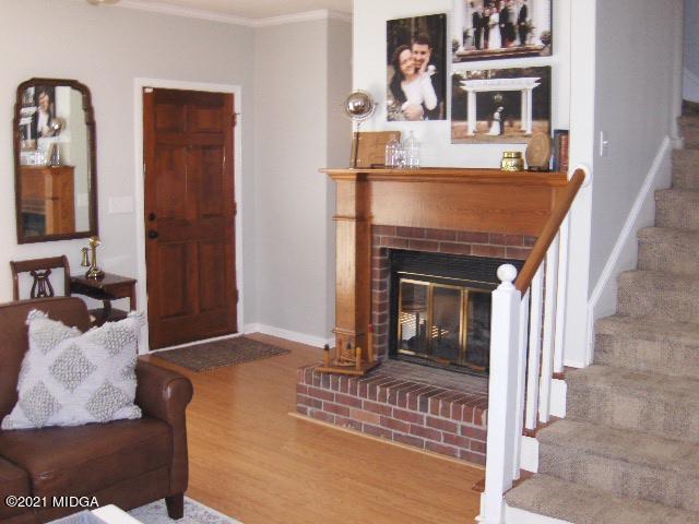 5771 Wakefield Way Macon, GA 31210 - Photo 2 of 34 a living room with furniture and a fireplace