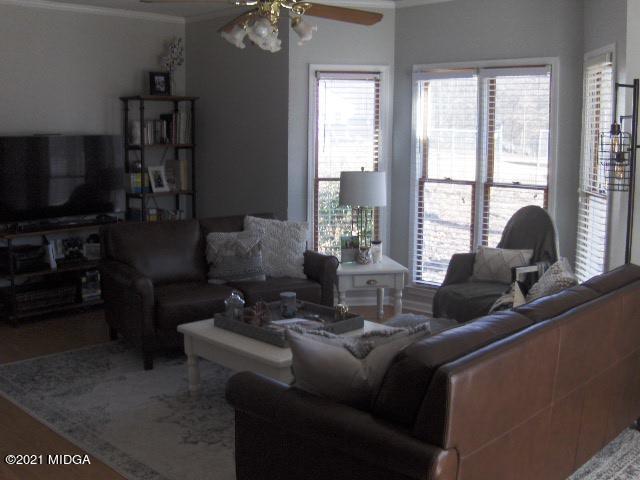 5771 Wakefield Way Macon, GA 31210 - Photo 3 of 34 a living room with furniture and a flat screen tv