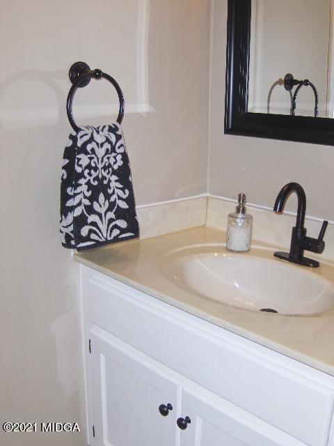 5771 Wakefield Way Macon, GA 31210 - Photo 5 of 34 a bathroom with a sink and a mirror