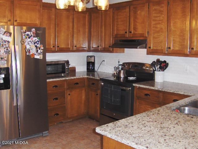 5771 Wakefield Way Macon, GA 31210 - Photo 6 of 34 a kitchen with stainless steel appliances granite countertop a refrigerator a stove a sink and dishwasher