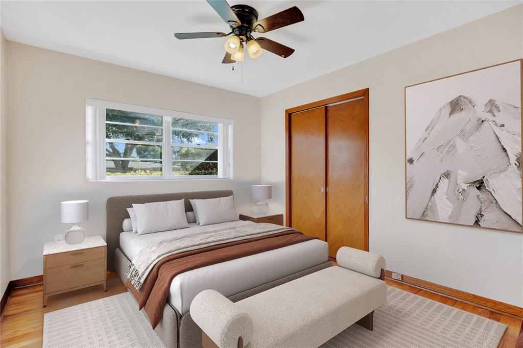 2807 Nancy Street Orlando, FL 32806 - Photo 14 of 27 a bedroom with a large bed and a window