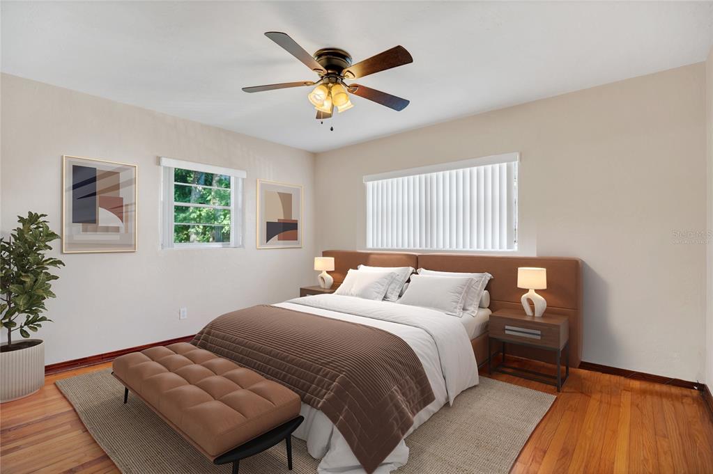 2807 Nancy Street Orlando, FL 32806 - Photo 19 of 27 a bedroom with a bed and a large window