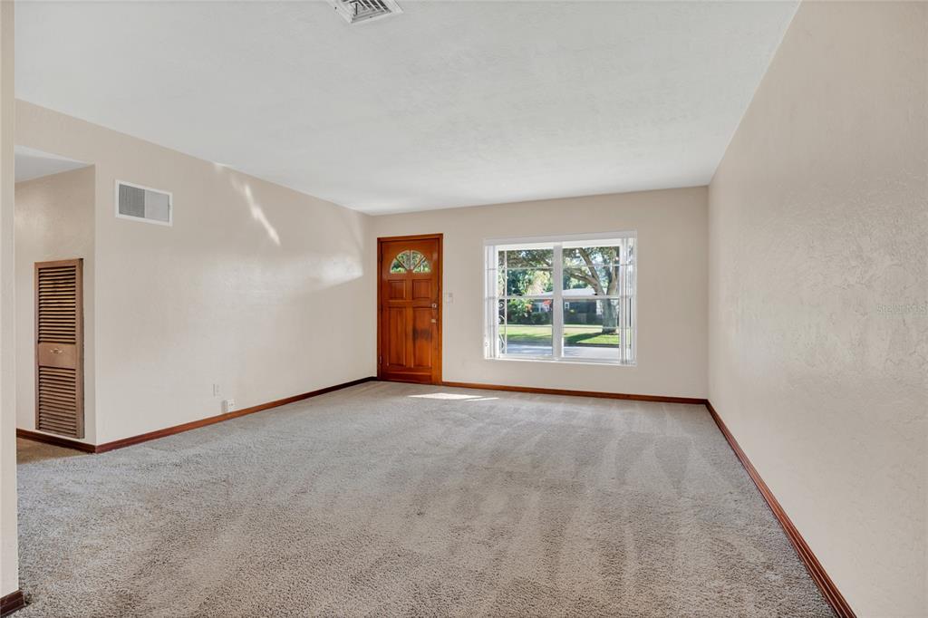 2807 Nancy Street Orlando, FL 32806 - Photo 4 of 27 an empty room with windows