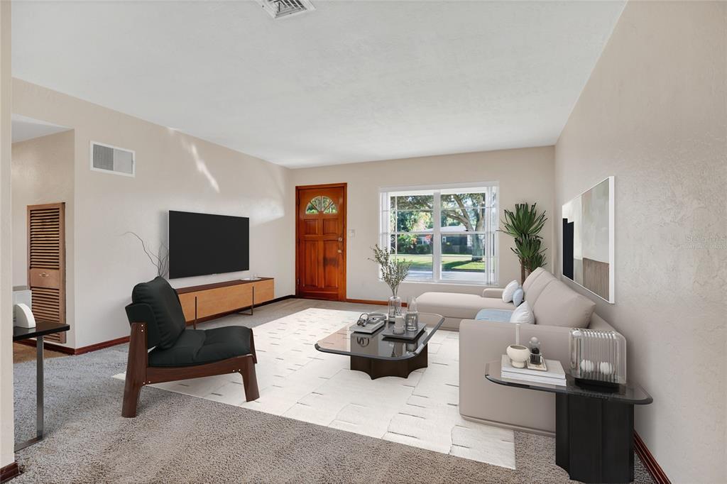 2807 Nancy Street Orlando, FL 32806 - Photo 5 of 27 a living room with furniture and a flat screen tv