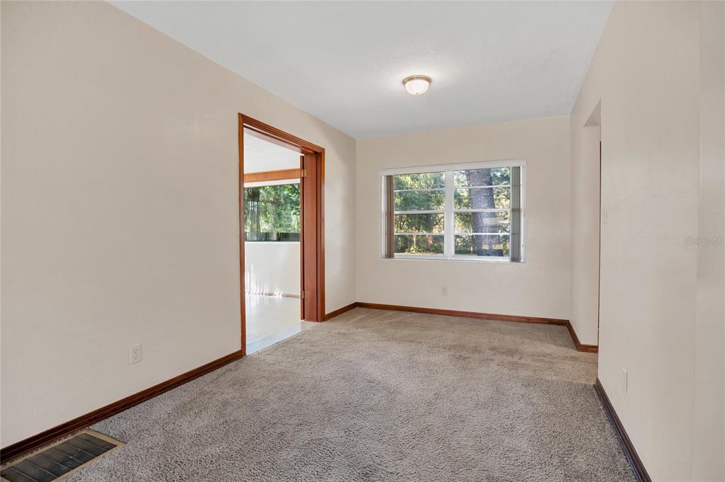 2807 Nancy Street Orlando, FL 32806 - Photo 7 of 27 an empty room with windows
