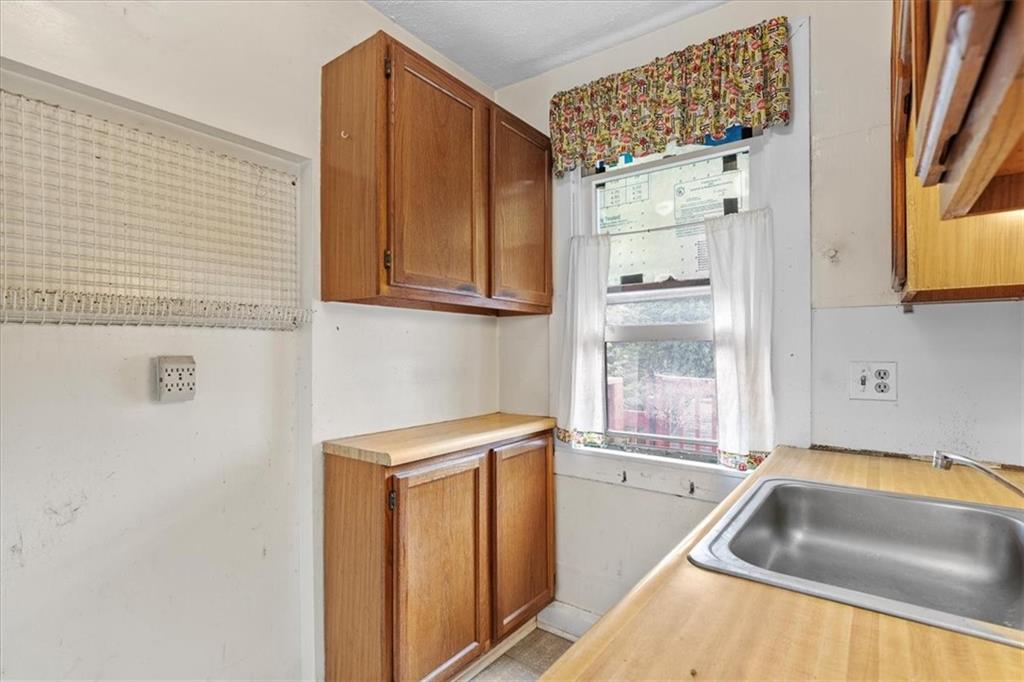 115 Meade Avenue Pittsburgh, PA 15202 - Photo 21 of 27 a bathroom with a tub sink and vanity
