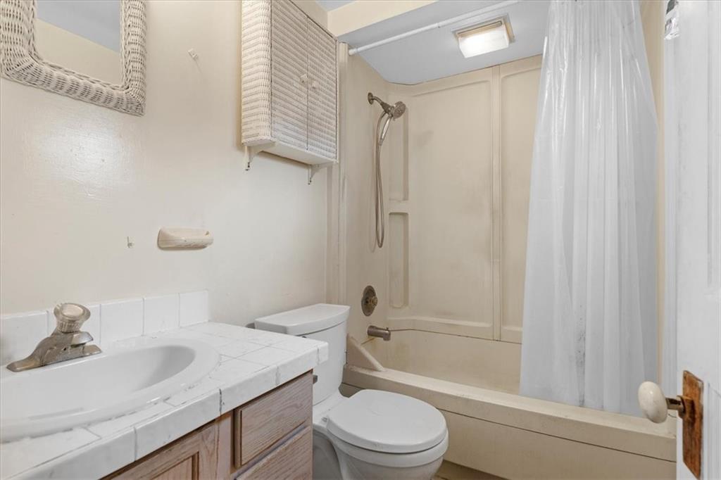 115 Meade Avenue Pittsburgh, PA 15202 - Photo 25 of 27 a bathroom with a sink a toilet and shower