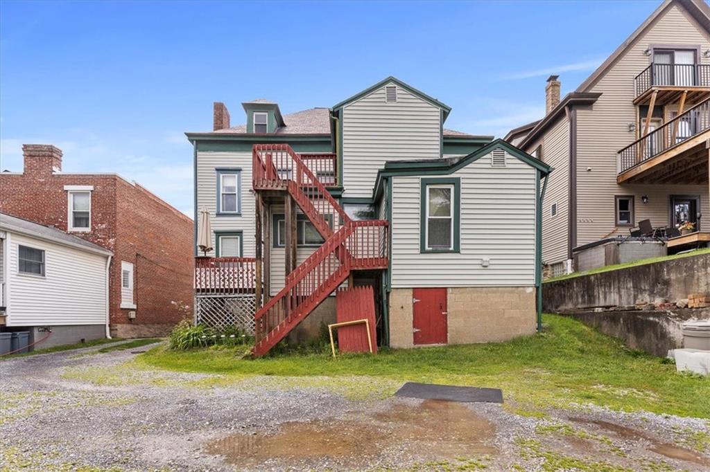 115 Meade Avenue Pittsburgh, PA 15202 - Photo 26 of 27 a view of a house with a yard and fence
