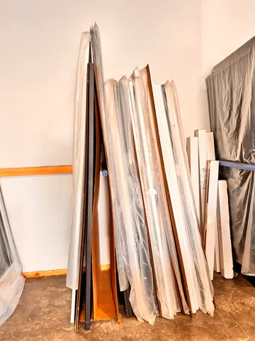 a view of an chairs and table in the room
