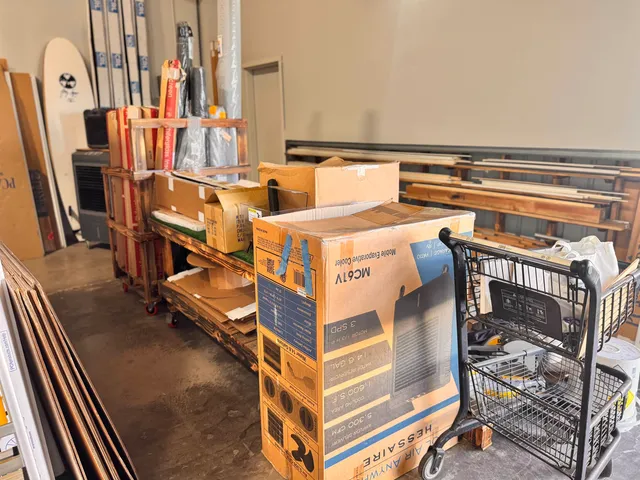 a view of a living room and kitchen with furniture
