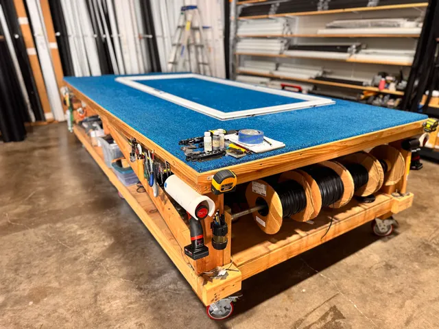 a bedroom with a bed and a table in it