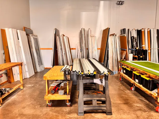a view of balcony with two chairs and a window