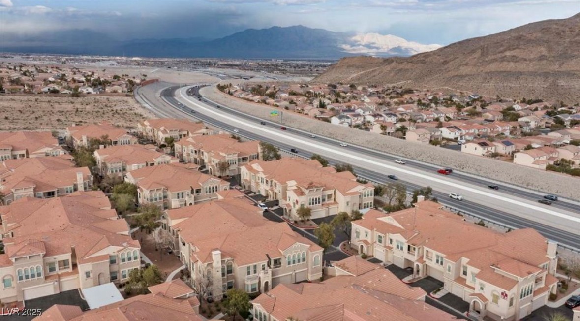 10550 West Alexander Road, Unit 2082 Las Vegas, NV 89129 - Photo 1 of 6 Aerial view of residential area with mountains