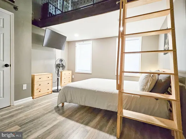 a living room with a couch and a large window