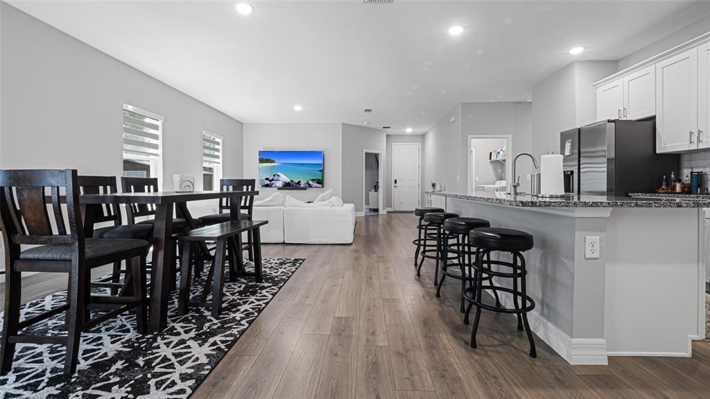 8007 Southwest 135th Loop Ocala, FL 34473 - Photo 11 of 47 a large kitchen with a table and chairs