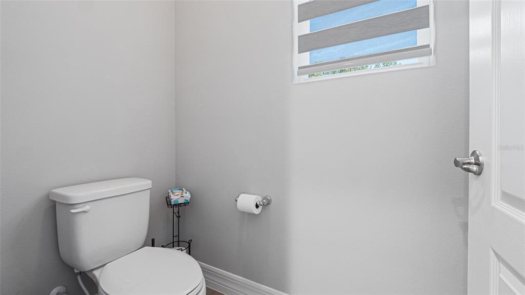 8007 Southwest 135th Loop Ocala, FL 34473 - Photo 22 of 47 a white toilet sitting next to a shower