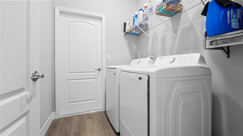 8007 Southwest 135th Loop Ocala, FL 34473 - Photo 24 of 47 a utility room with dryer and washer
