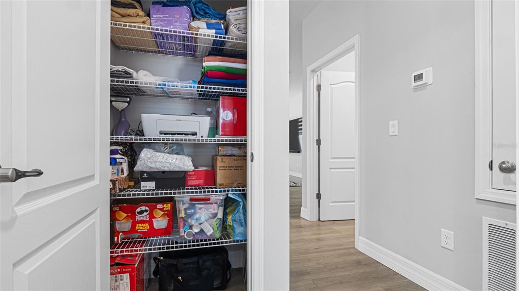 8007 Southwest 135th Loop Ocala, FL 34473 - Photo 30 of 47 a room with storage and utility