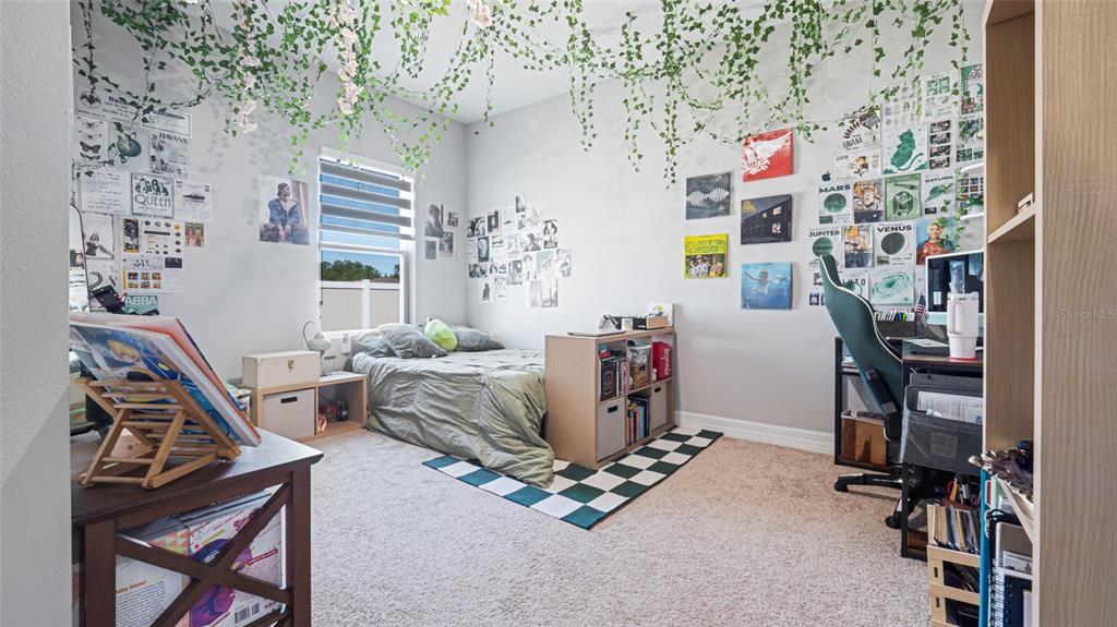 8007 Southwest 135th Loop Ocala, FL 34473 - Photo 31 of 47 a living room with furniture and a flat screen tv