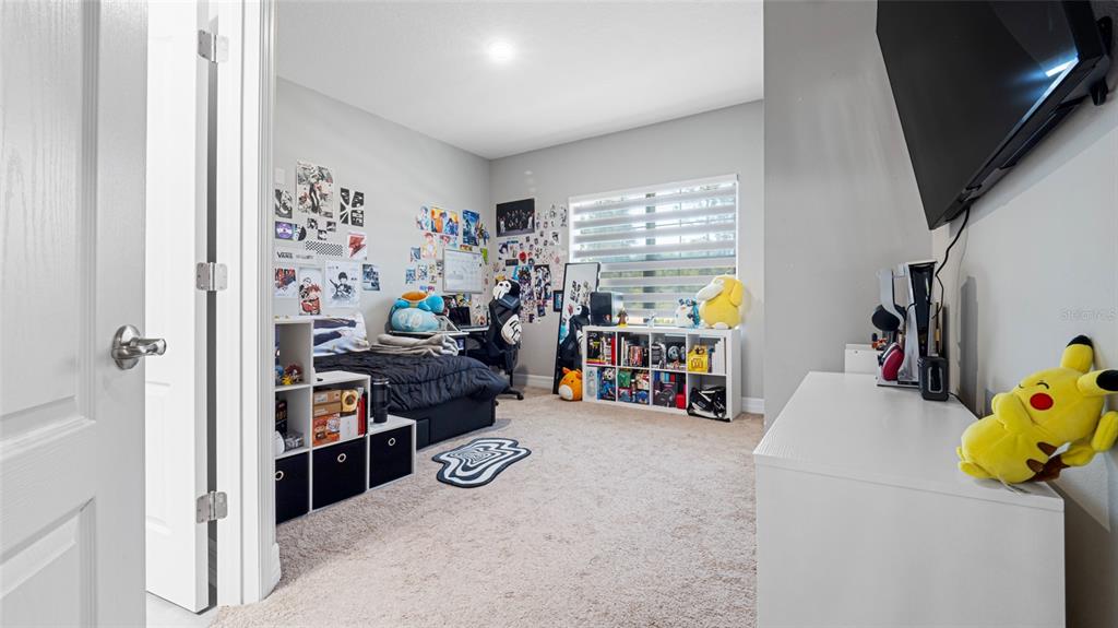 8007 Southwest 135th Loop Ocala, FL 34473 - Photo 34 of 47 a view of a room with toys and a window